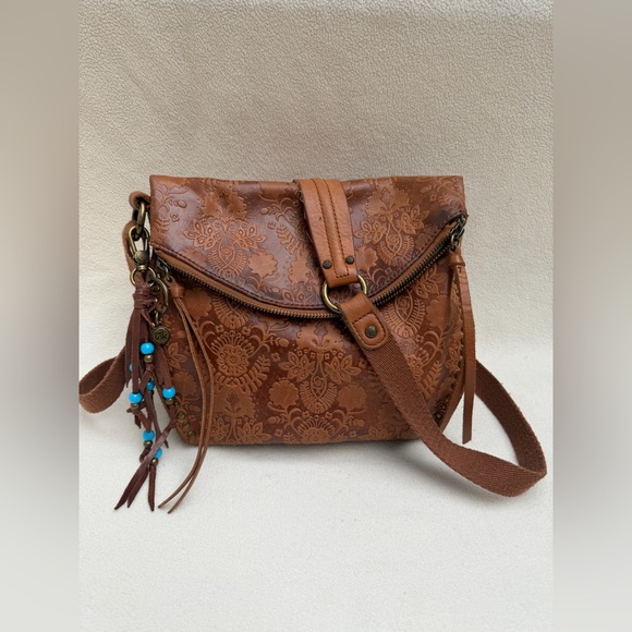 The Sak Handbags - The Sak Silverlake Crossbody Bag in the Tobacco Floral Emboss color.